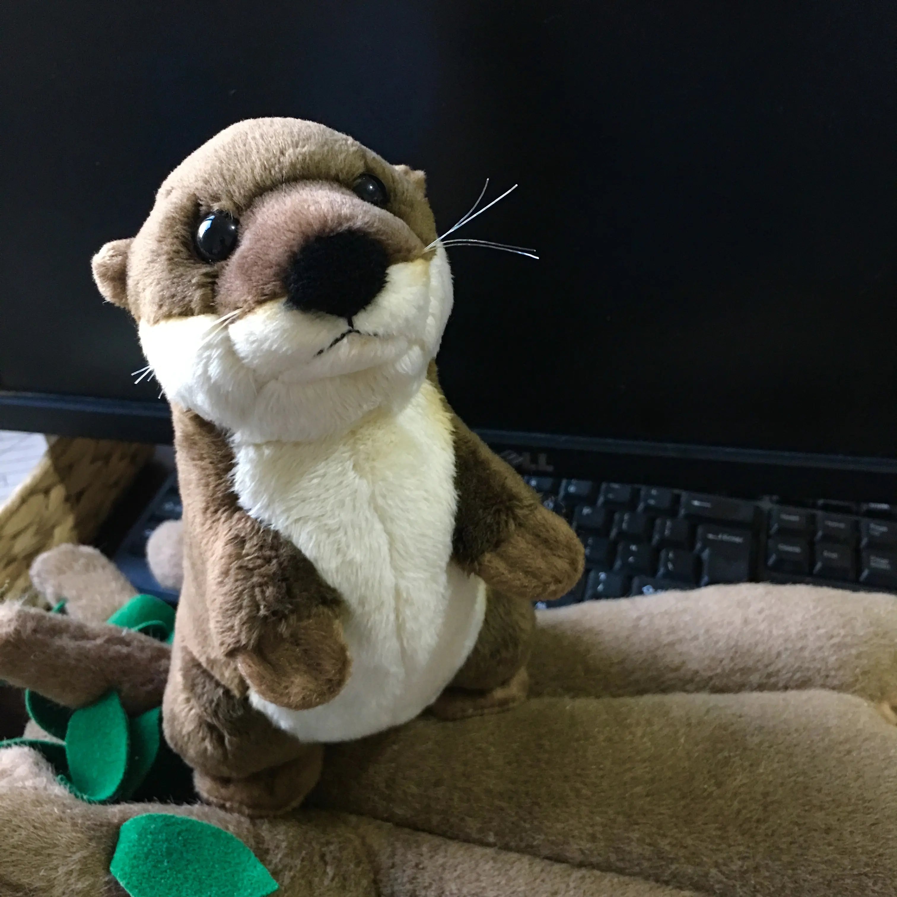 Customizable Plush Otter Mascot with Logo Design